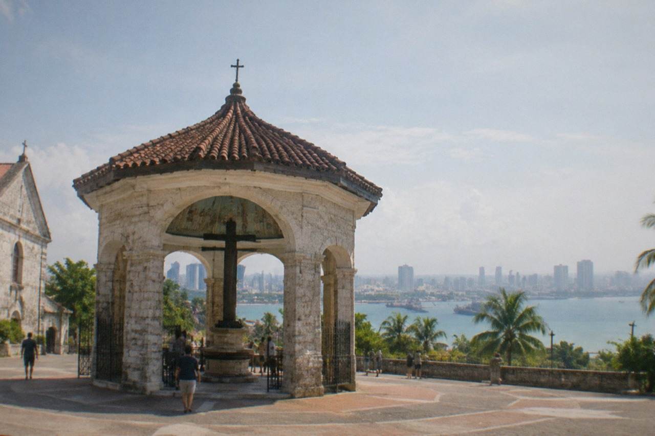 Cebu City skyline with apartment towers and office buildings rising above the Mactan Channel shoreline