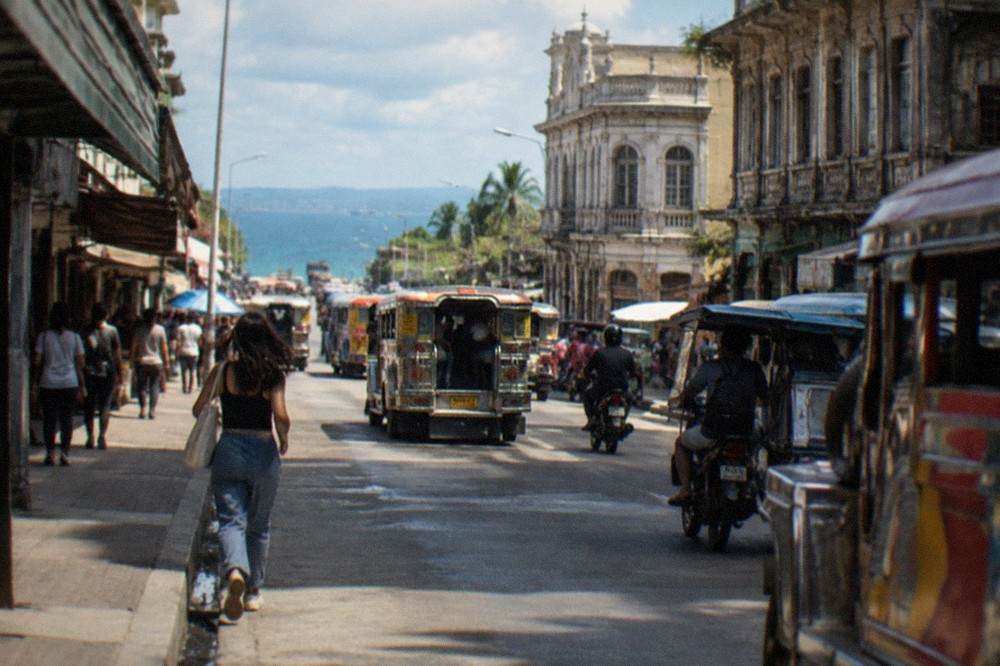 Colon Street in downtown Cebu City with heritage buildings and jeepney traffic