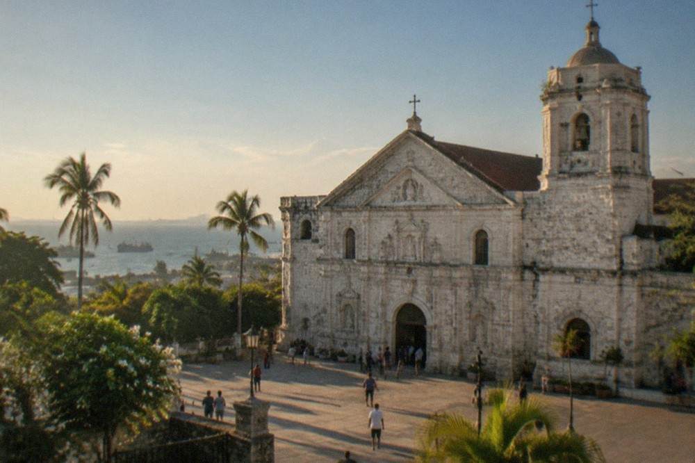 The restored bell tower of the Basilica del Santo Nino rising above the rooftops of old Cebu City