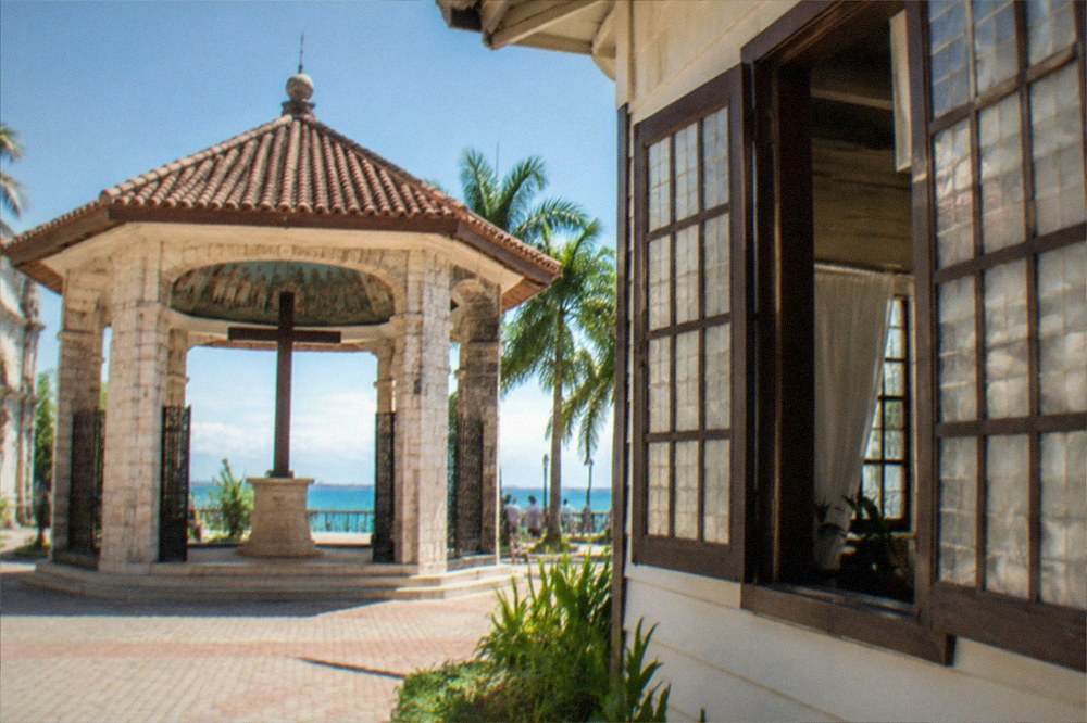 A wide shuttered window with capiz shell panes in a colonial-era house in Cebu City