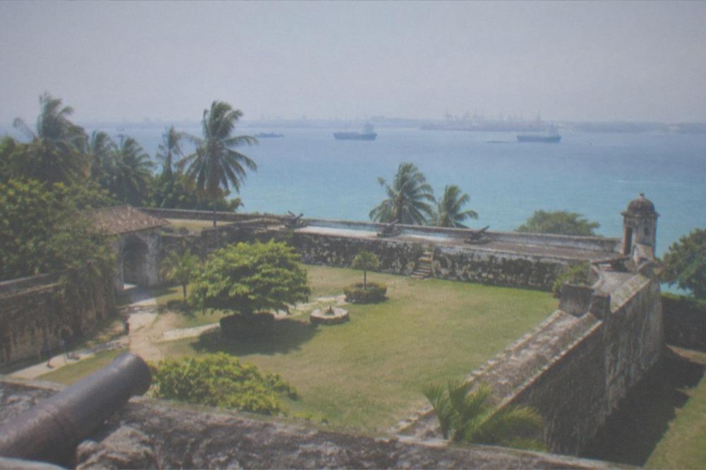 Colonial stone walls of Fort San Pedro with a grassy courtyard inside
