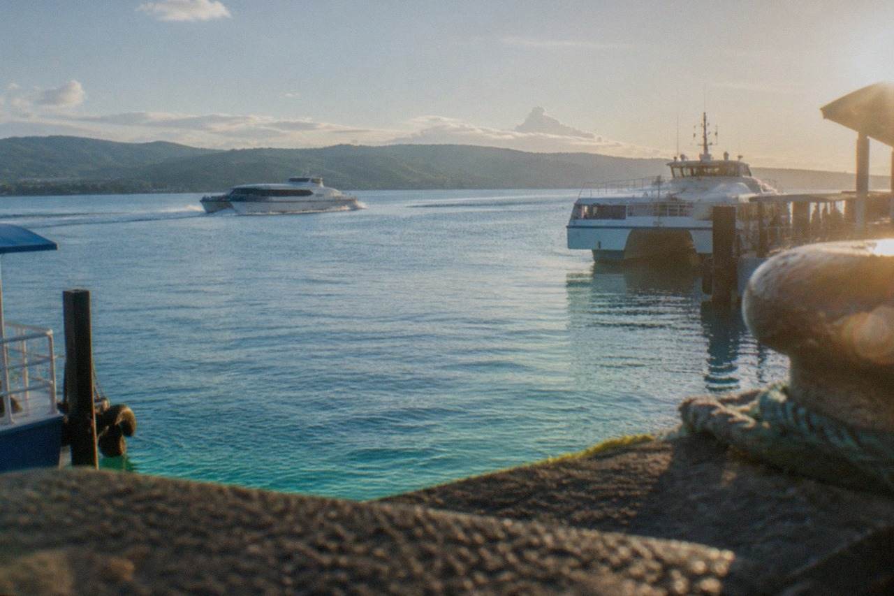 A fastcraft ferry crossing calm blue water between Cebu and Bohol islands in the Philippines
