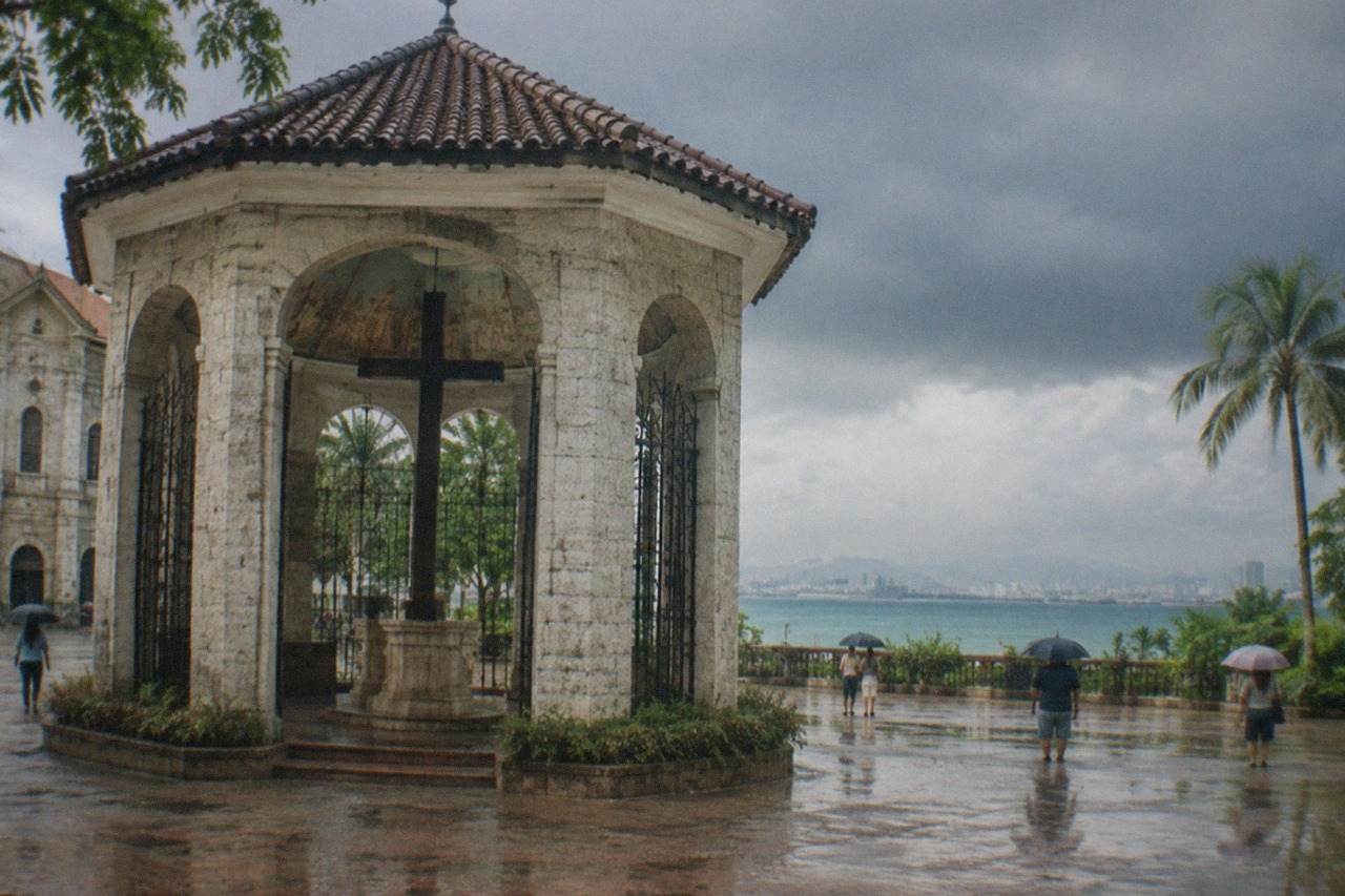 Dark rain clouds gathering over the Cebu City skyline and the Mactan Channel