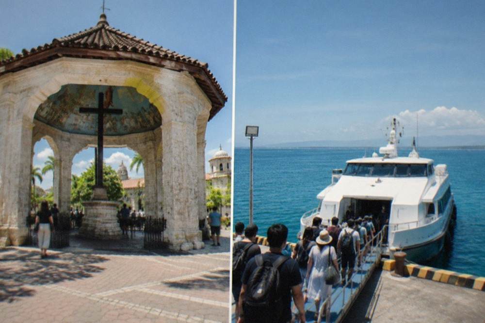 Passengers boarding a white fastcraft ferry at a busy Cebu pier in morning light